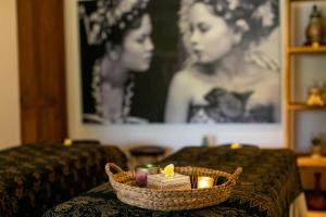 a table with a basket with candles on it at S Resorts Hidden Valley Bali in Uluwatu