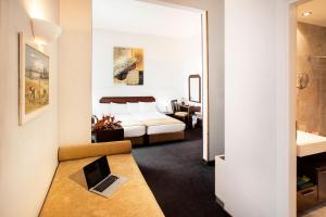 Ένα ή περισσότερα κρεβάτια σε δωμάτιο στο Arni Hotel Domotel 