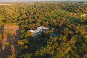 an aerial view of a house in the woods at Sevanagama in Habarana