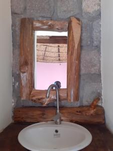 a sink in a bathroom with a window at Bethan Amba ecovillage in Lalibela