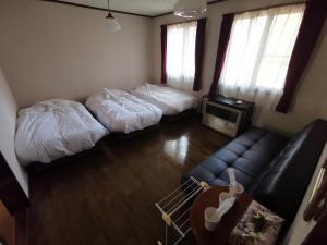 Postel nebo postele na pokoji v ubytování Hakuba Powder Republic