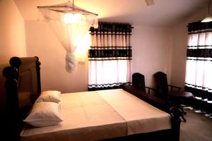 Voodi või voodid majutusasutuse Hiriketiya Orchid Villa toas