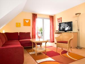 Televiisor ja/või meelelahutuskeskus majutusasutuses Ostsee Residenz Meeresblick Meeresrauschen