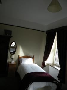 Letto o letti in una camera di Buggle's Pub and Accommodation