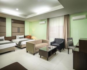 Postel nebo postele na pokoji v ubytování Hotel Alia Cikini