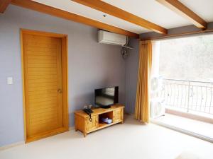 A television and/or entertainment center at Yangji Pine Resort