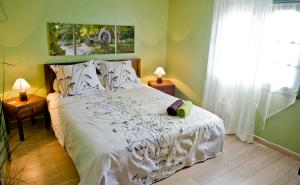 Ένα ή περισσότερα κρεβάτια σε δωμάτιο στο Le Ruisseau