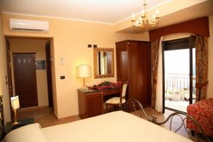 Cama ou camas em um quarto em Agostiniana Hotel