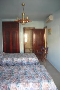 Posteľ alebo postele v izbe v ubytovaní Palm Beach Sea