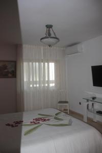 Posteľ alebo postele v izbe v ubytovaní Palm Beach Sea + 10 fotografií