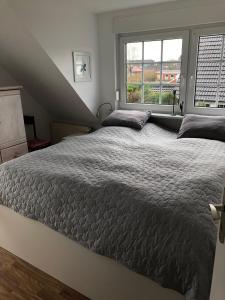 Ένα ή περισσότερα κρεβάτια σε δωμάτιο στο Wohnung B Haus Pamela
