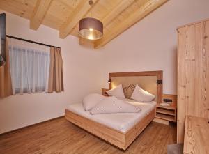Posteľ alebo postele v izbe v ubytovaní Apart Montagna