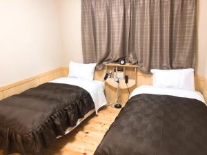 Ένα ή περισσότερα κρεβάτια σε δωμάτιο στο Business Hotel Crescent