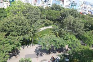 an overhead view of a park with trees and a pond at Liberty Hotel Saigon Parkview in Ho Chi Minh City