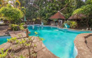 a swimming pool in a resort at Bali Kembali Hotel in Sanur