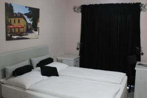 Postel nebo postele na pokoji v ubytování Hotel Bakarni Lonac
