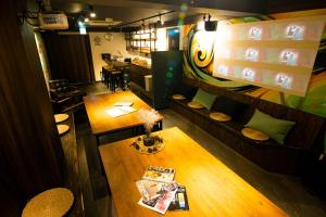 an overhead view of a restaurant with a table and chairs at R Hostel Namba south in Osaka