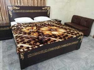 Voodi või voodid majutusasutuse Star Hotel Lahore toas