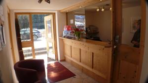 a kitchen with a counter and a door to a garage at Haus Zangerl in Sankt Anton am Arlberg