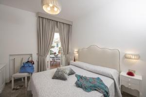 Postel nebo postele na pokoji v ubytování Palazzo Gargano Amalfi