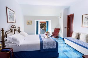 Postel nebo postele na pokoji v ubytování Ravello Art Hotel Marmorata