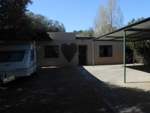 a building with a heart painted on the side of it at Wilreco self carting 2 bedroom flat. in Bloemfontein