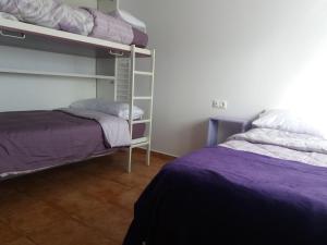 A bed or beds in a room at Casa Rural La Galana Albacete Még 33 kép