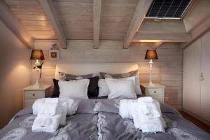 Tempat tidur dalam kamar di Ferienhaus Nest