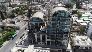 an aerial view of a building in a city at Aquamarine Luxury Residence in Kyrenia