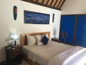 Postel nebo postele na pokoji v ubytování Blue Monkey Retreat Areguling Lombok