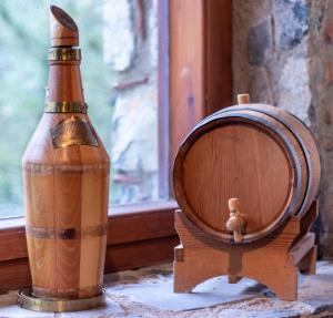 a bottle and a wooden barrel next to a window at Kardama HideAway in Kato Amiandos