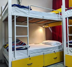 a bunk bed in a room with two bunk beds at The Desire Hostel in New Delhi