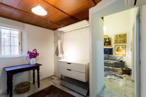 a room with a closet with a desk and a couch at PRETTY DUPLEX IN BOHEMIAN DISTRICT-CITY CENTER in Seville