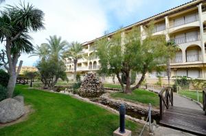 a building with a park in front of a building at JARDINS DEL MAR 36 in L'Estartit