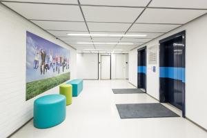 a room with a blue wall and a blue floor at Forenom Hostel Vantaa Airport in Vantaa