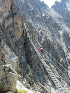 a suspension bridge on the side of a mountain at Cervus in Passo del Tonale