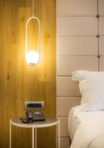 Posteľ alebo postele v izbe v ubytovaní Carpe Diem Boutique Hotel