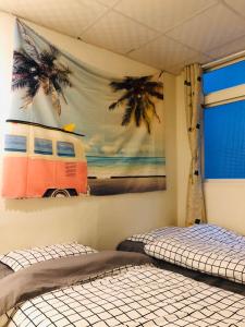 Ein Bett oder Betten in einem Zimmer der Unterkunft Tourism B&B
