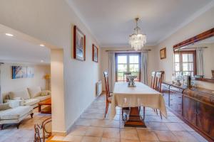 a kitchen and dining room with a table and chairs at Villa Portals Nous by Priority in Portals Nous