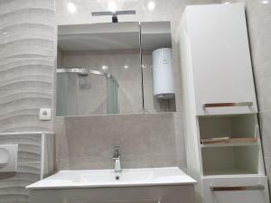 a bathroom with a sink and a mirror at Apartmani Marjana in Supetar +34 photos