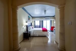 Voodi või voodid majutusasutuse Baker's Suites toas