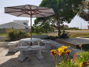 A patio or other outdoor area at Beachcombers Bed & Breakfast 