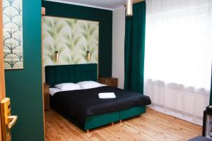 Posteľ alebo postele v izbe v ubytovaní Elegant Apartments