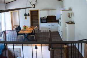 a kitchen with a table and a dining room at Am Krummbach in Isny im Allgäu