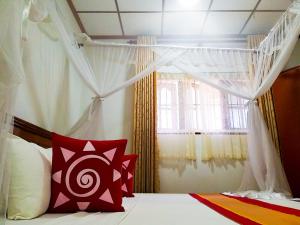 Postel nebo postele na pokoji v ubytování Sahana Sri Villa