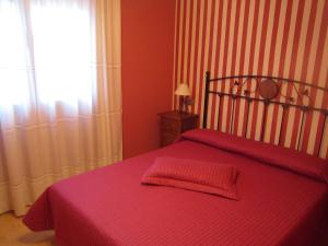 Cama o camas de una habitación en Apartamentos Almagro