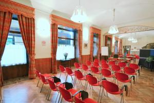 a room with a bunch of chairs and a podium at Hotel Roma e Rocca Cavour in Turin