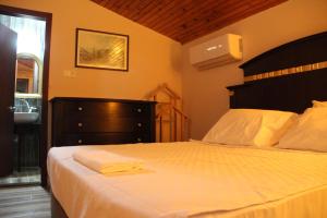 Voodi või voodid majutusasutuse Adrasan La Casita Hotel toas