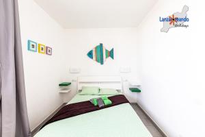 Posteľ alebo postele v izbe v ubytovaní Vivienda Vacacional Malu + 15 fotografií