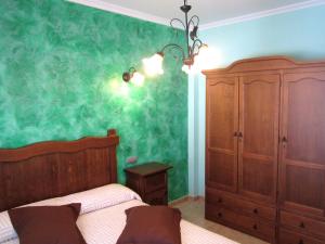 Cama o camas de una habitación en Apartamentos Almagro